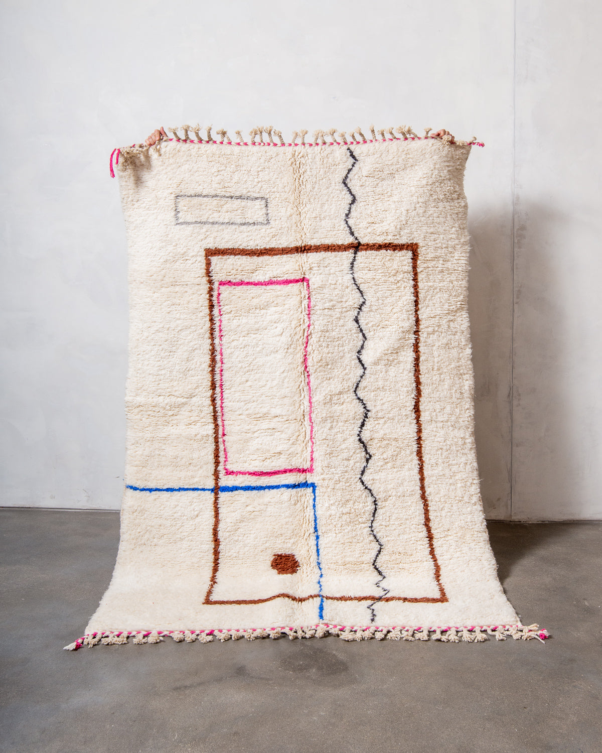 Modern, designer, handcrafted Berber rug from Morocco. Beniourain carpet with beautiful colours and patterns and fluffy wool texture.